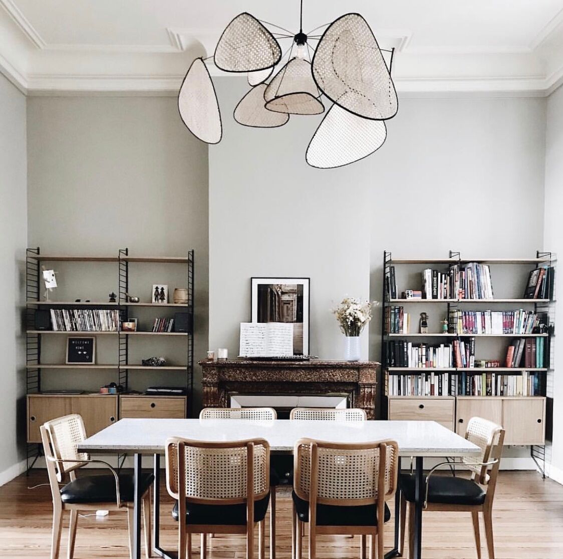 4 light wood canning chairs with black leather armrests