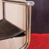 Folding cantilever chair in tubular metal