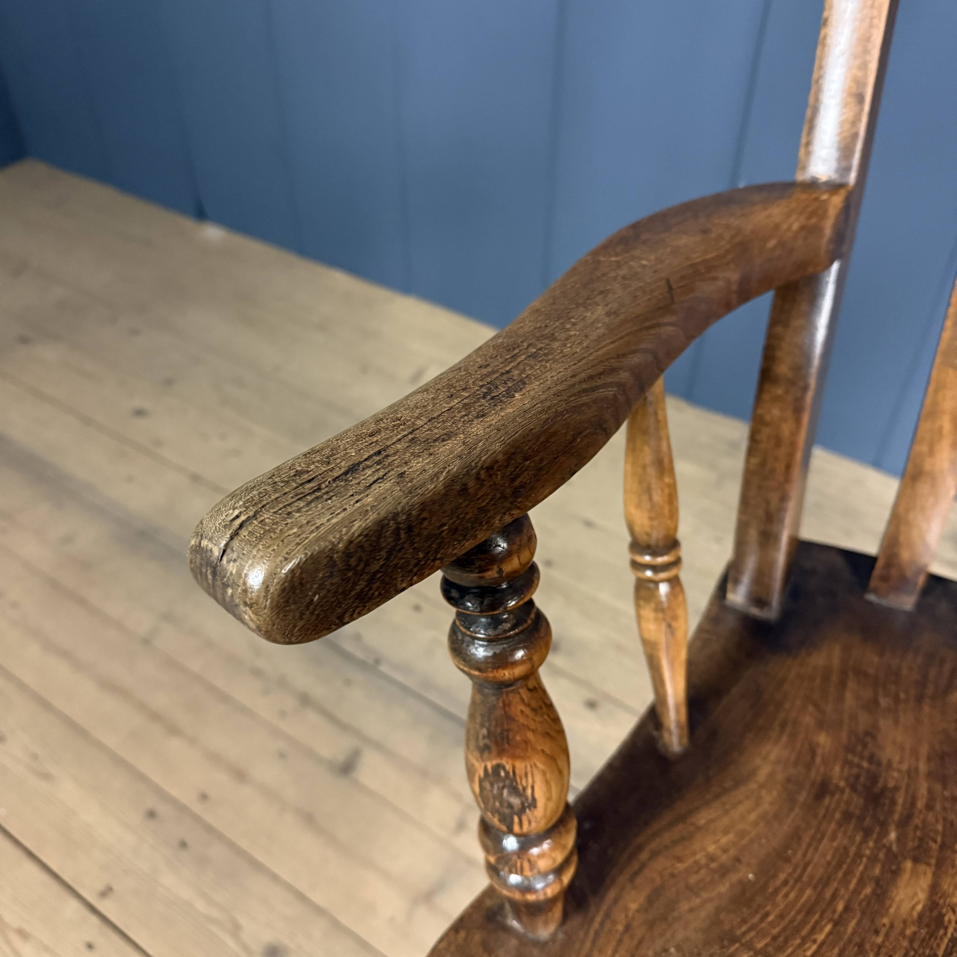 Brown English Windsor armchair with high back