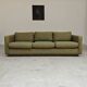 Pierre Frey modernist bench in green and gold patterned fabric