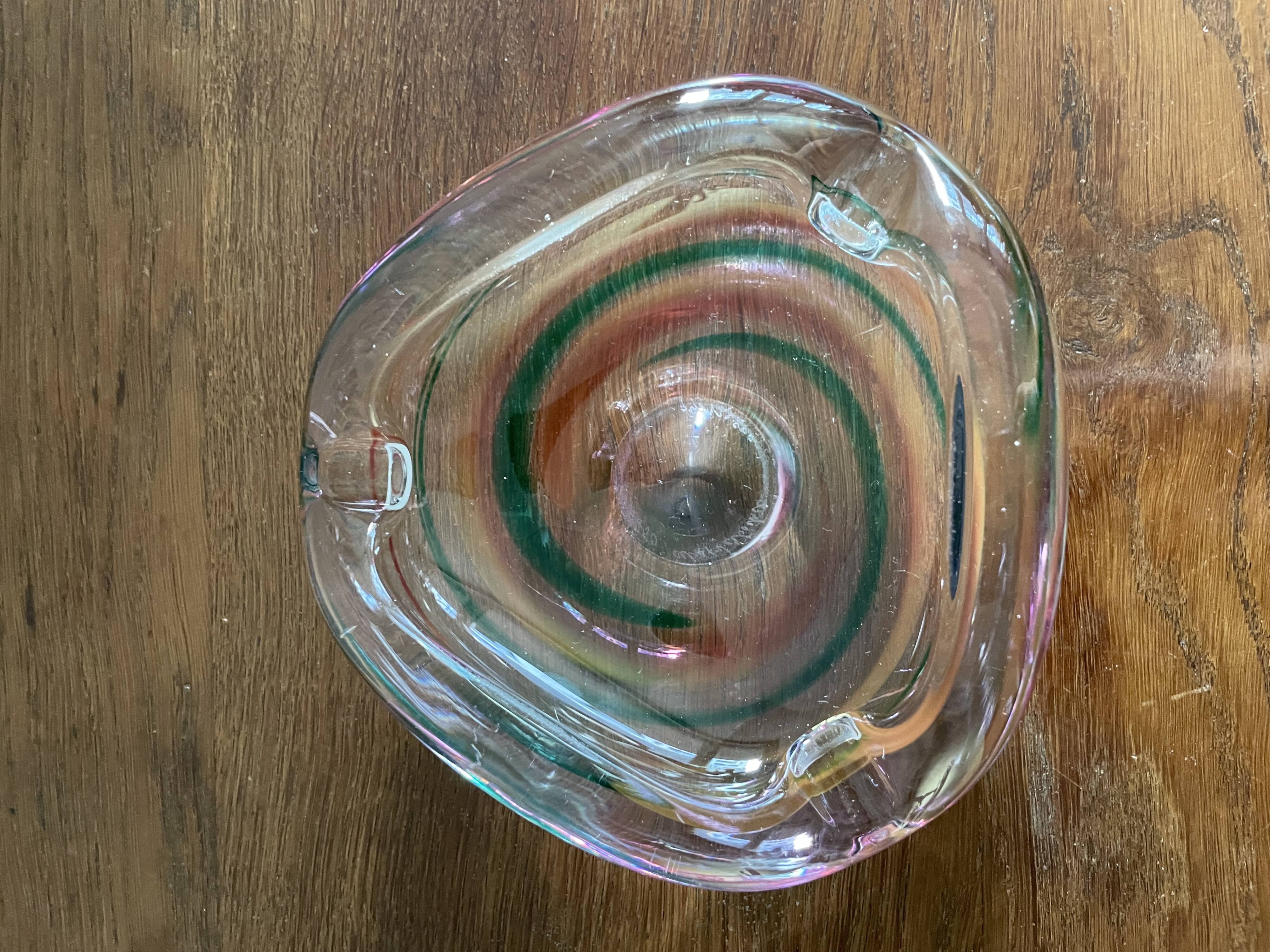 Clear with a soft coloured swirl pattern, round, glass ashtray