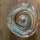 Clear with a soft coloured swirl pattern, round, glass ashtray