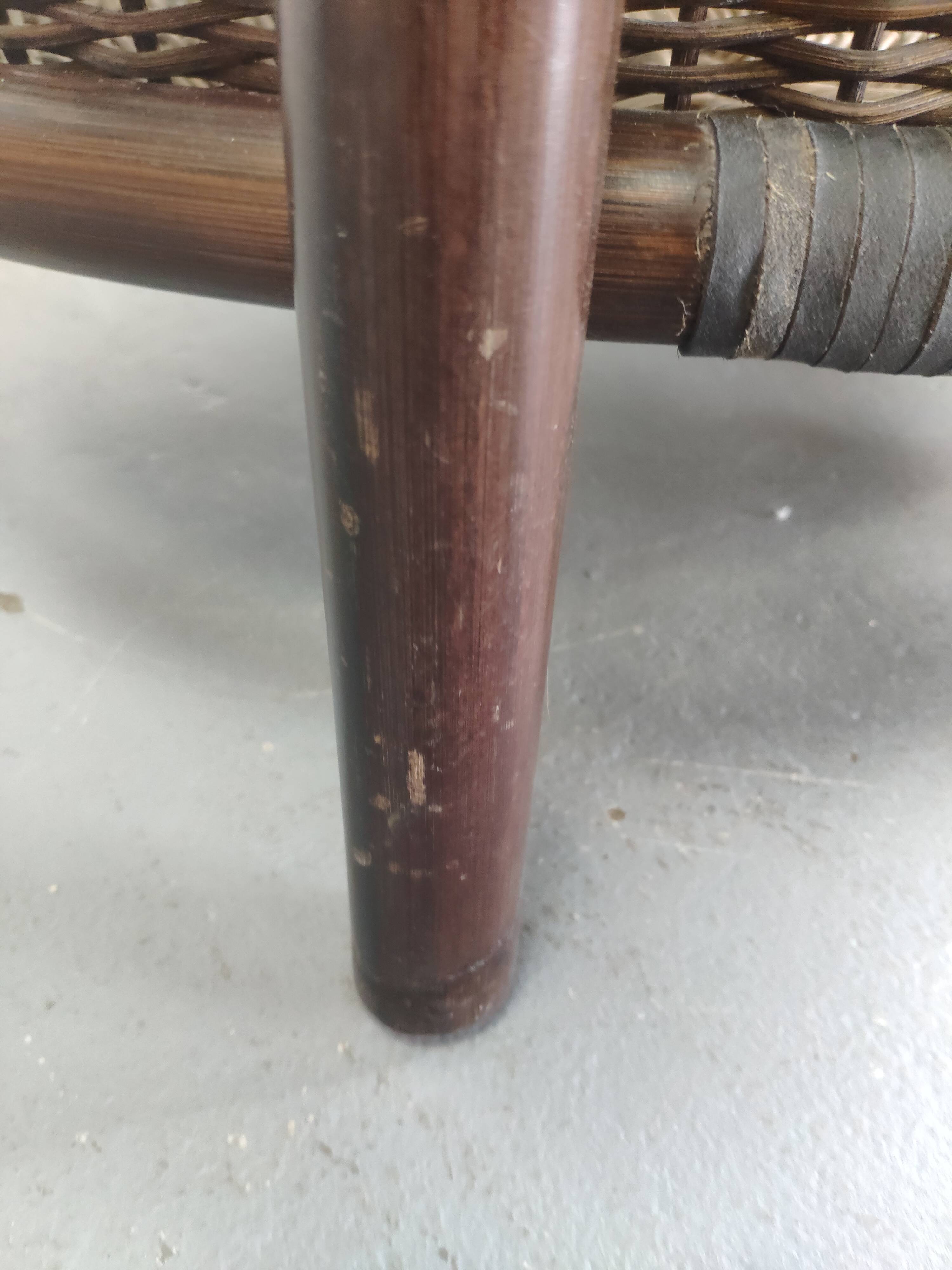 Vintage rattan coffee table with smoked glass top and rattan basket shelf