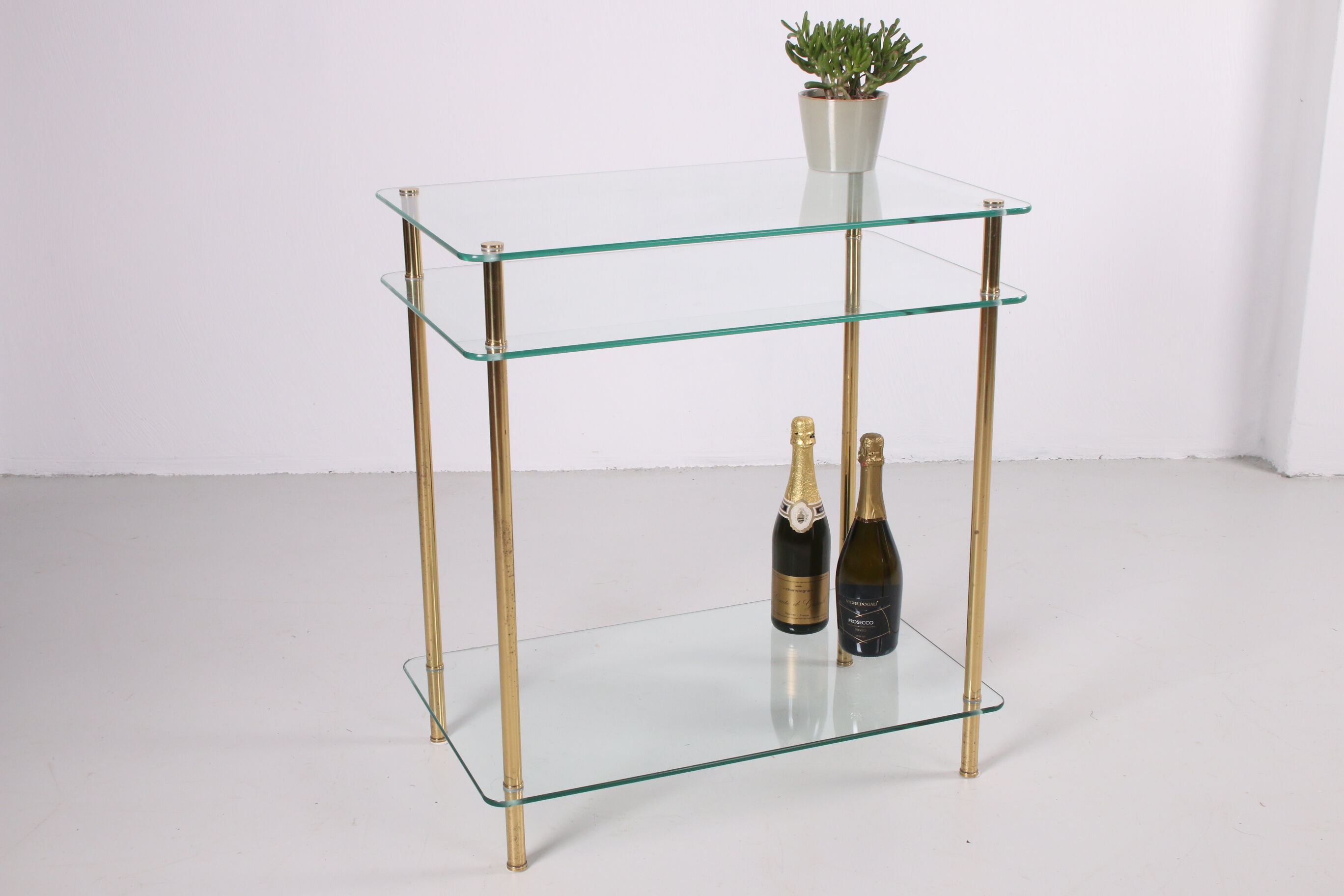 Hollywood Regency side table with gold-colored legs