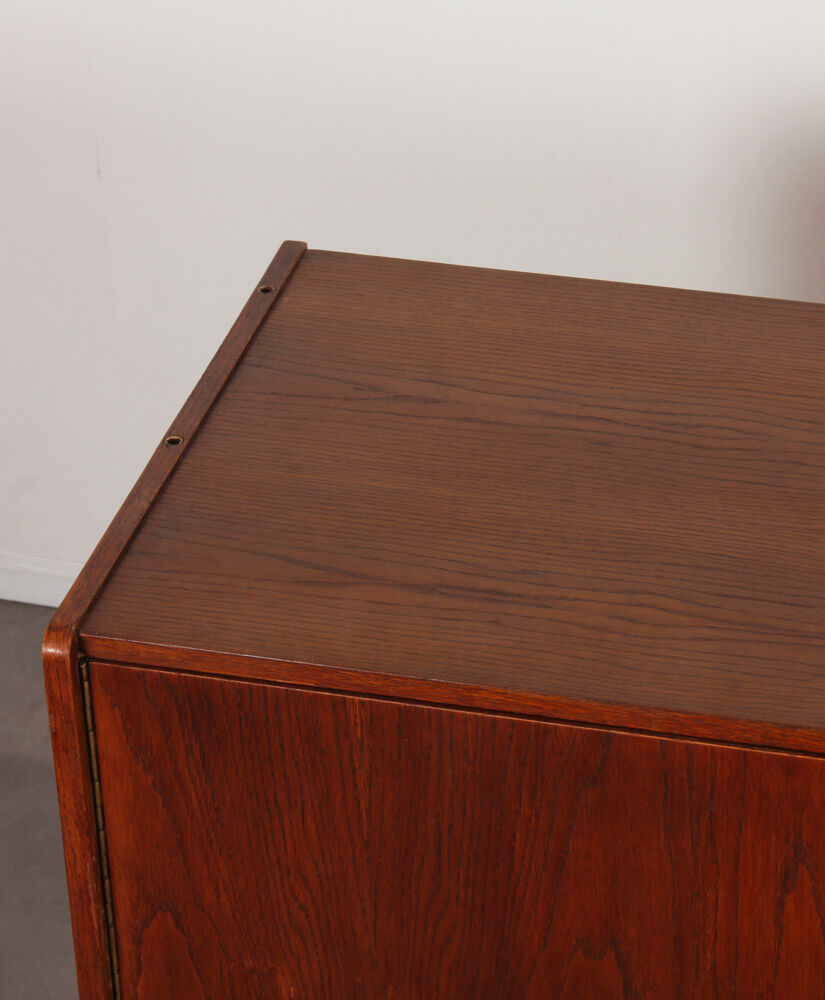 Oak sirdeboard with yellow and black drawers by Jiri Jiroutek, 1960