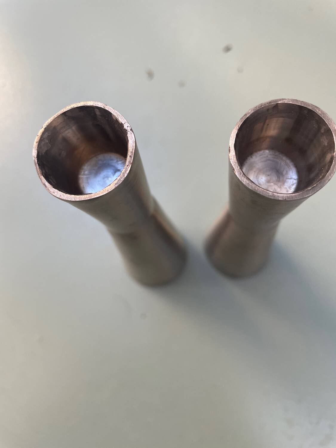 Pair of aluminum candlesticks