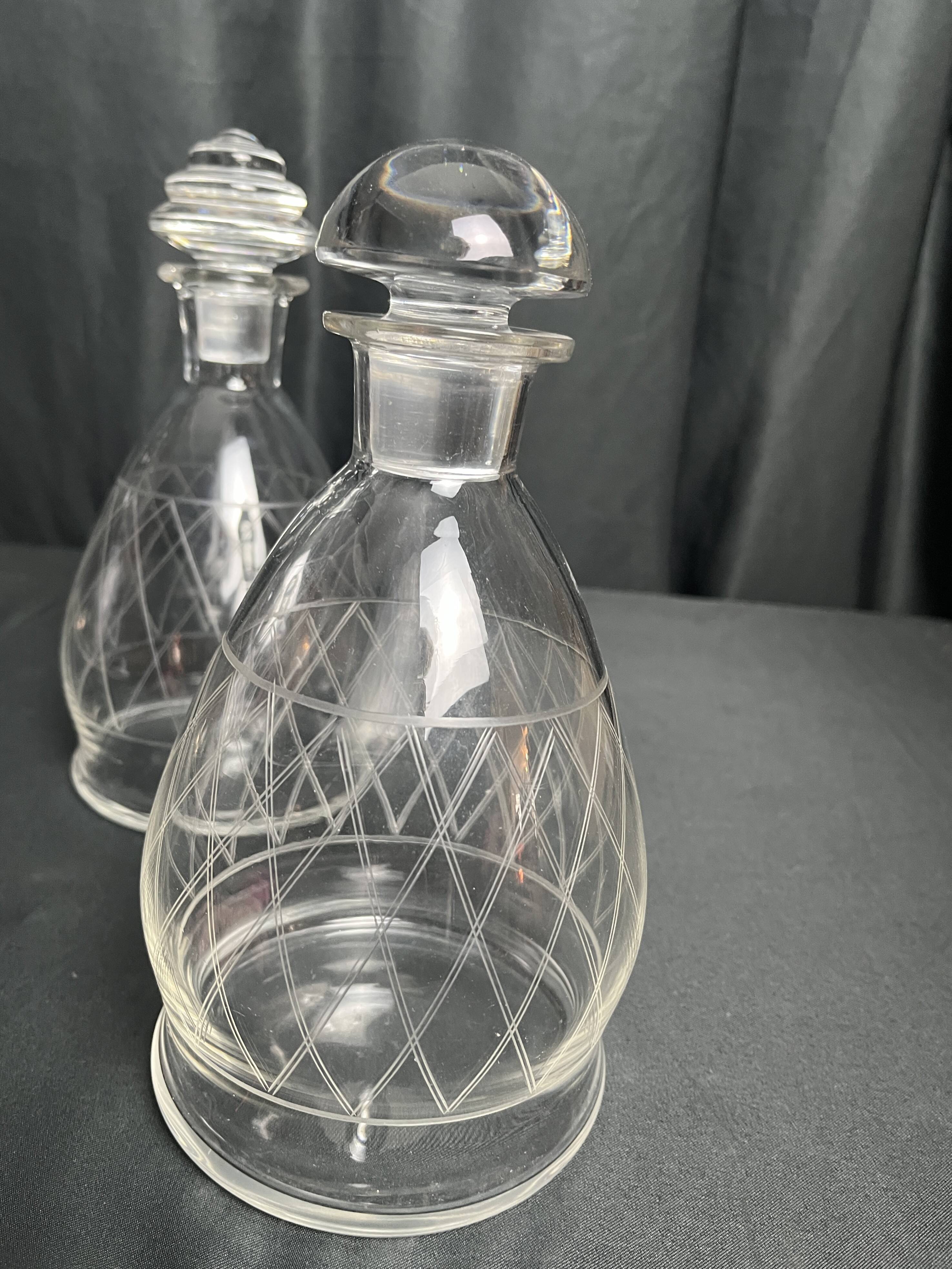 Tableware, two engraved crystal carafes with stoppers from around 1940.