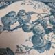 Antique trivet in Gien tile with blue bird decoration – wooden border