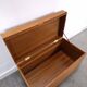 Vintage teak Danish chest with a lid on wheels, toy chest.