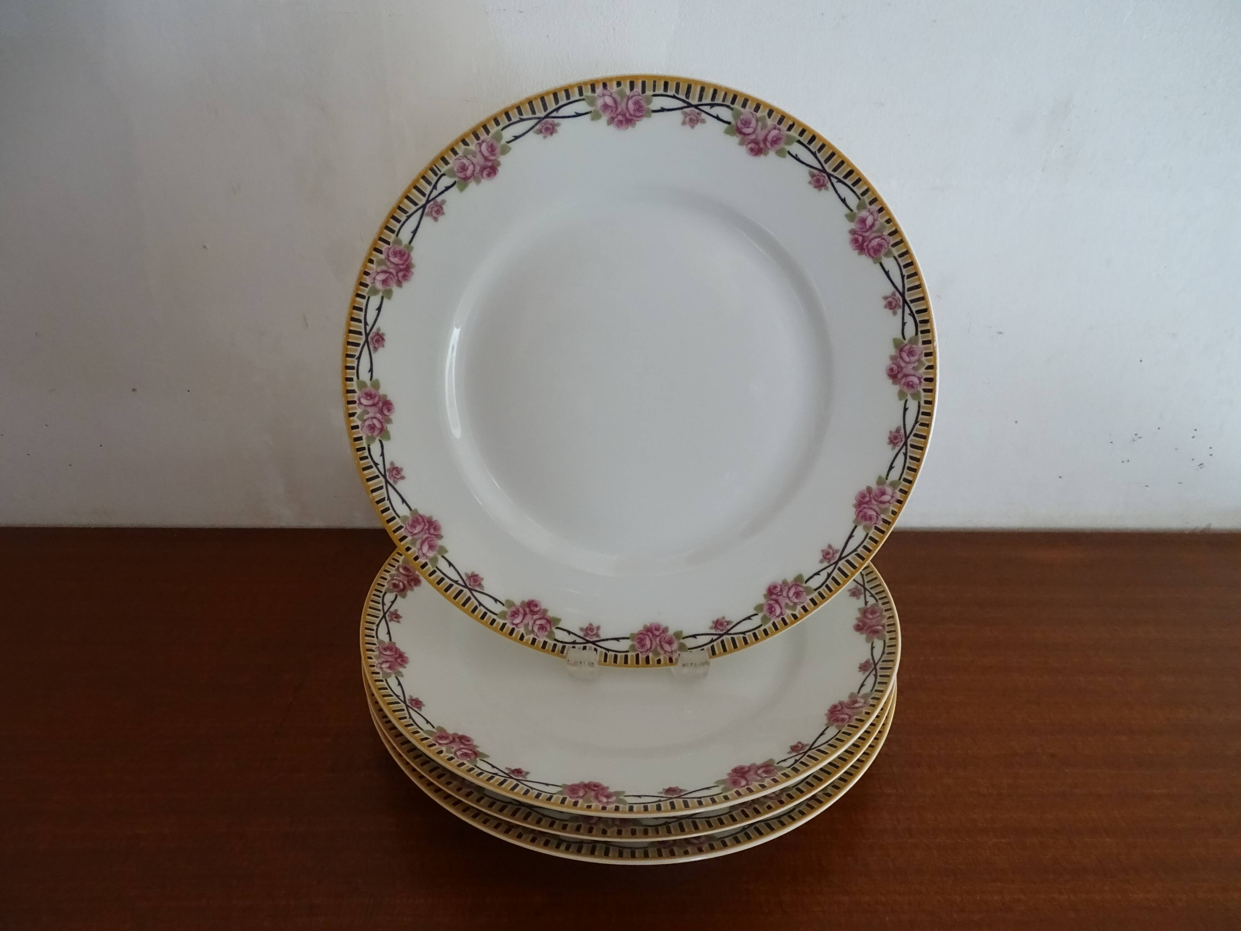 4 assiettes plates porcelaine Limoges Theodore Haviland motifs Art Deco Ø 24, cm