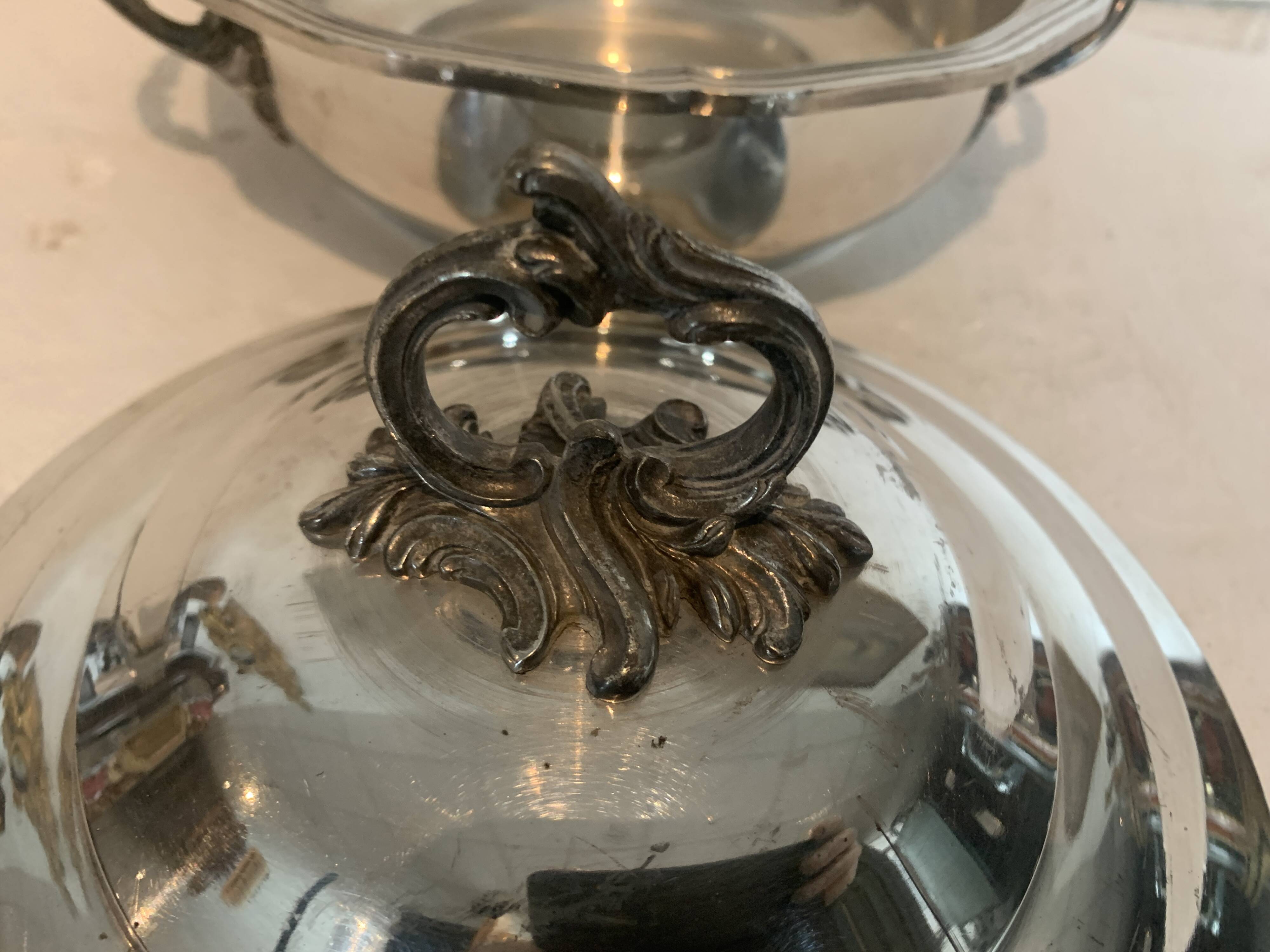 Covered broth and two small silver-plated dishes, 20th century