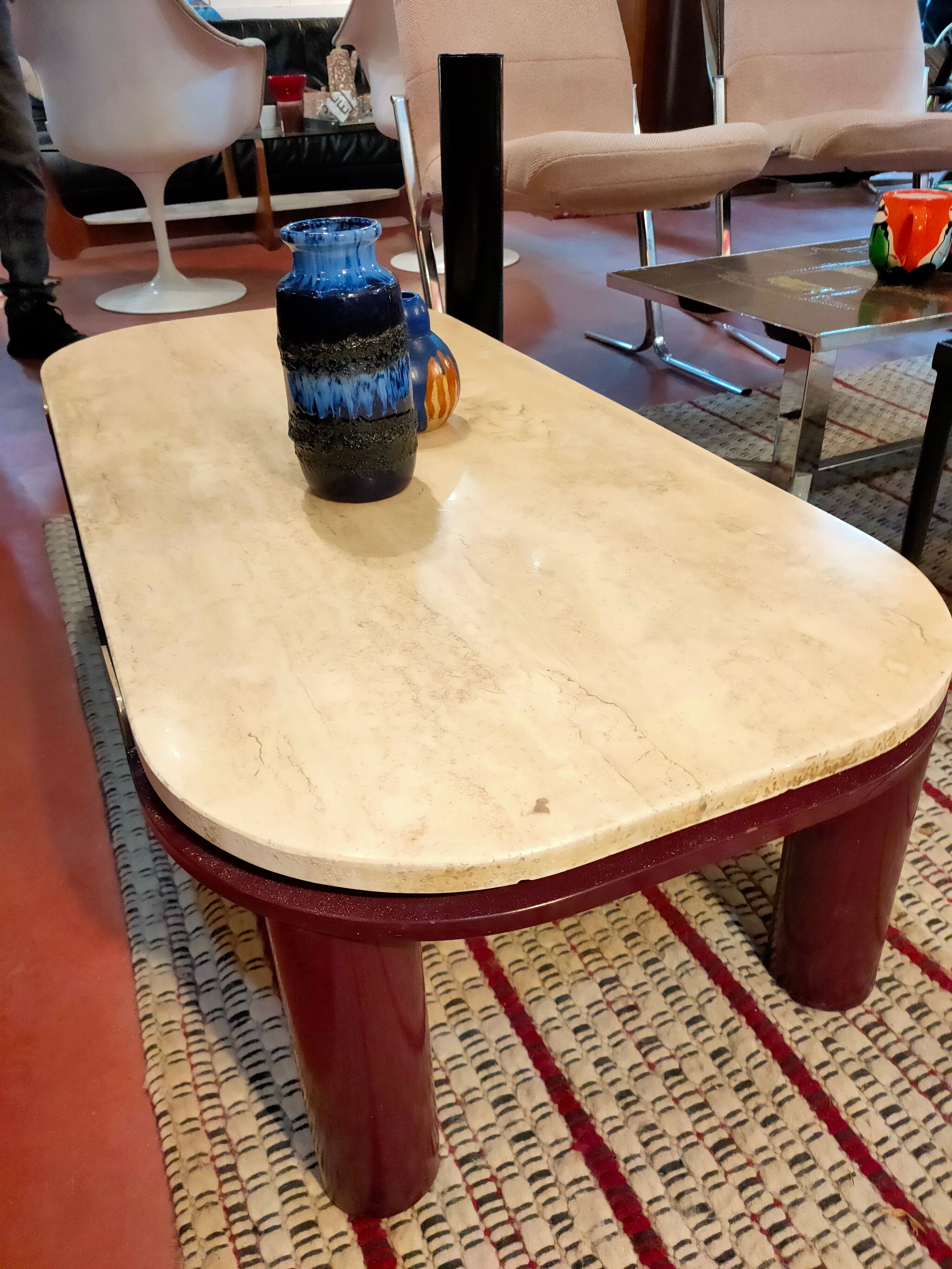 Coffee table Travertine top, garnet-colored metal stand and legs.  Long