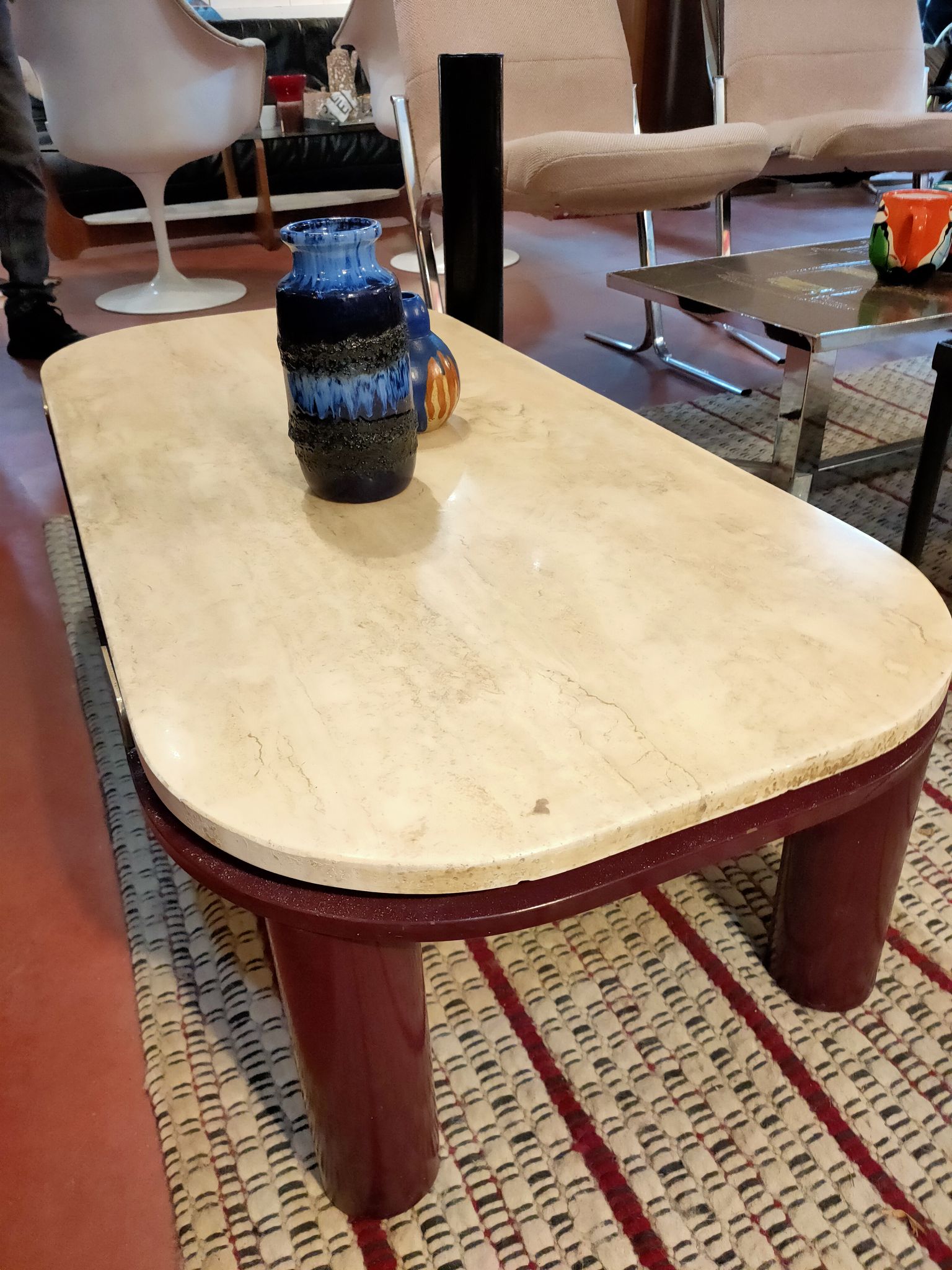 Coffee table Travertine top, garnet-colored metal stand and legs.  Long