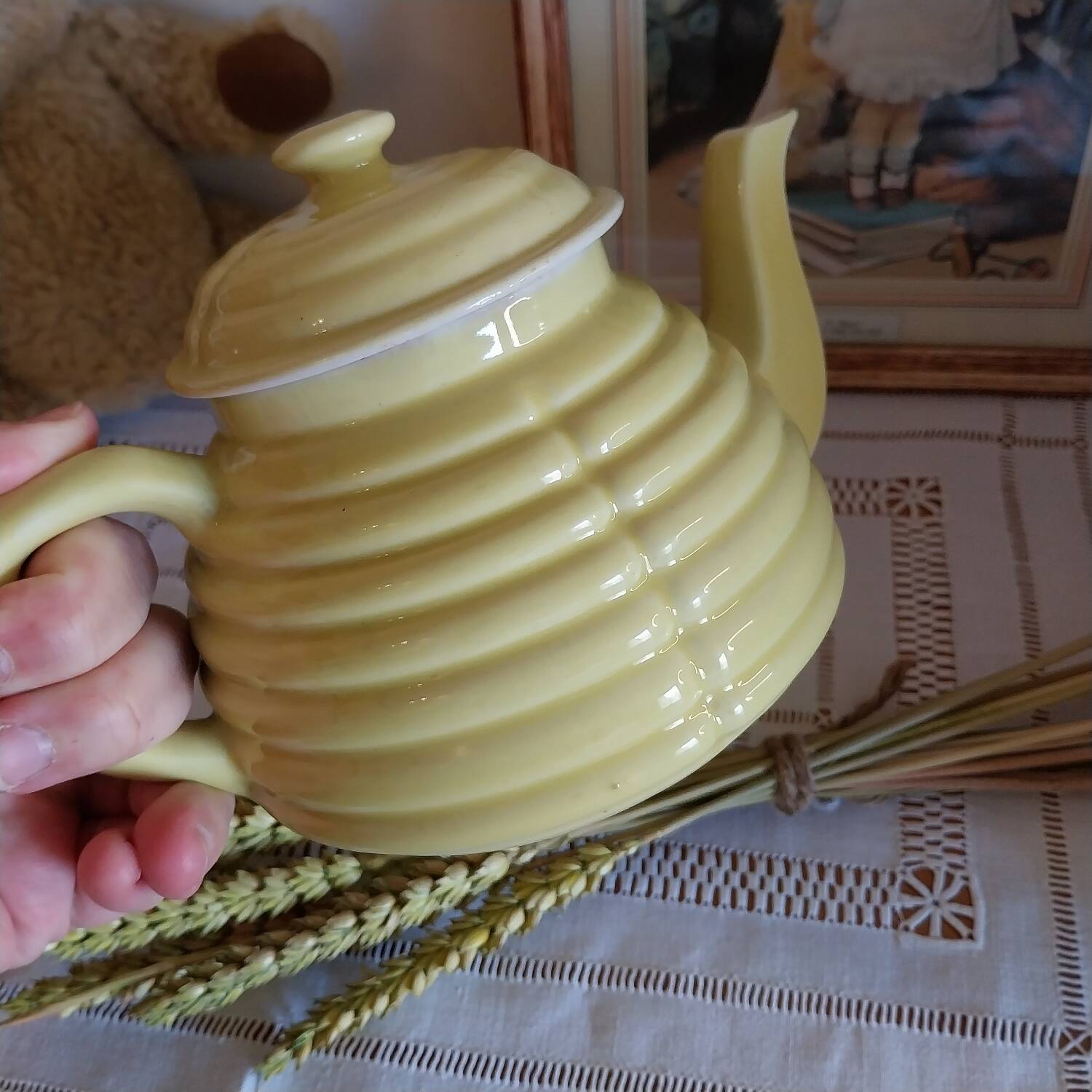Old yellow earthenware teapot