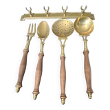 Old kitchen utensils in brass and wood.