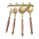 Old kitchen utensils in brass and wood.