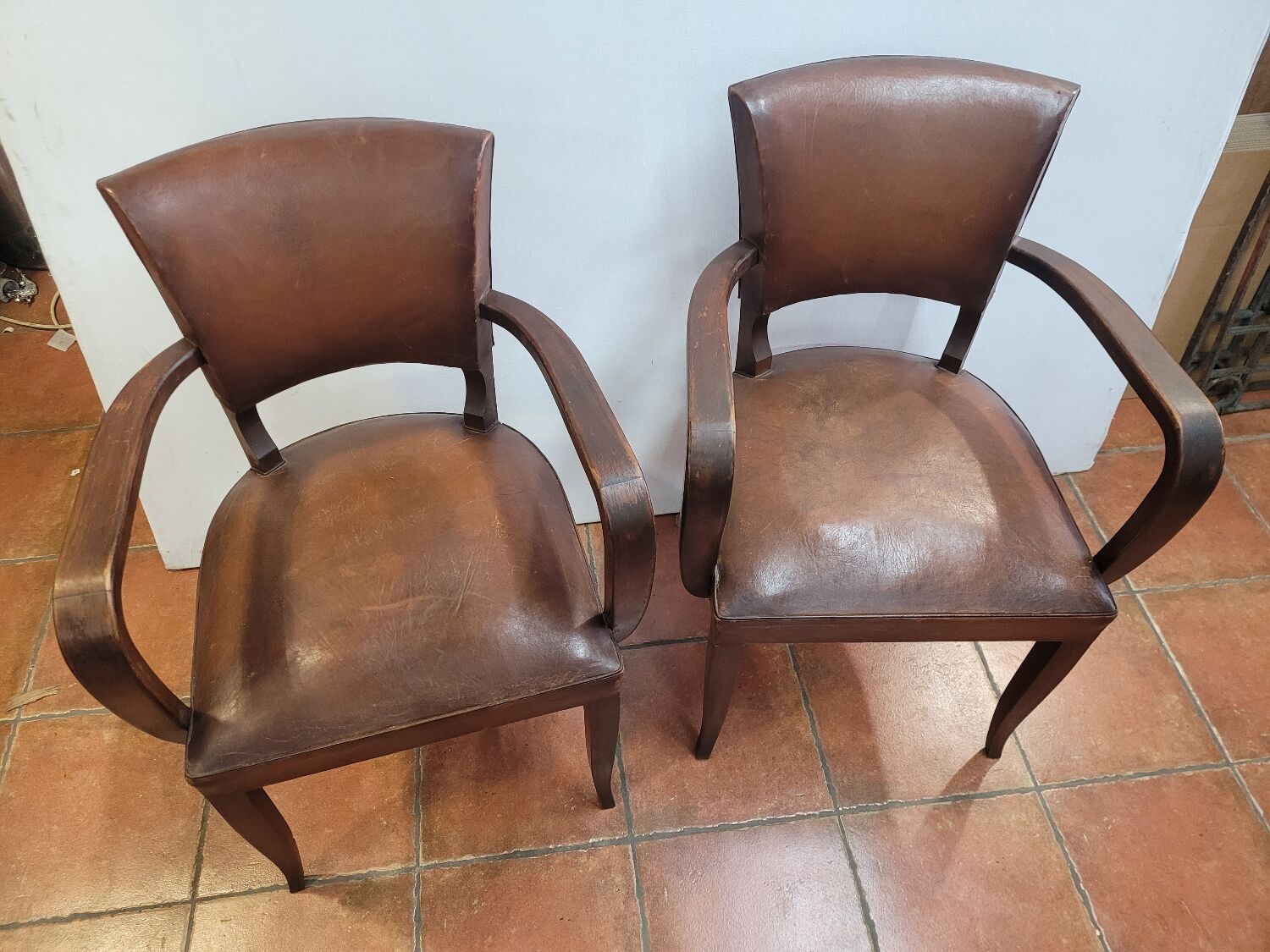 Pair of antique leather bridge armchairs