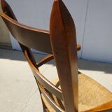 Grandfather's armchair in wood and straw.