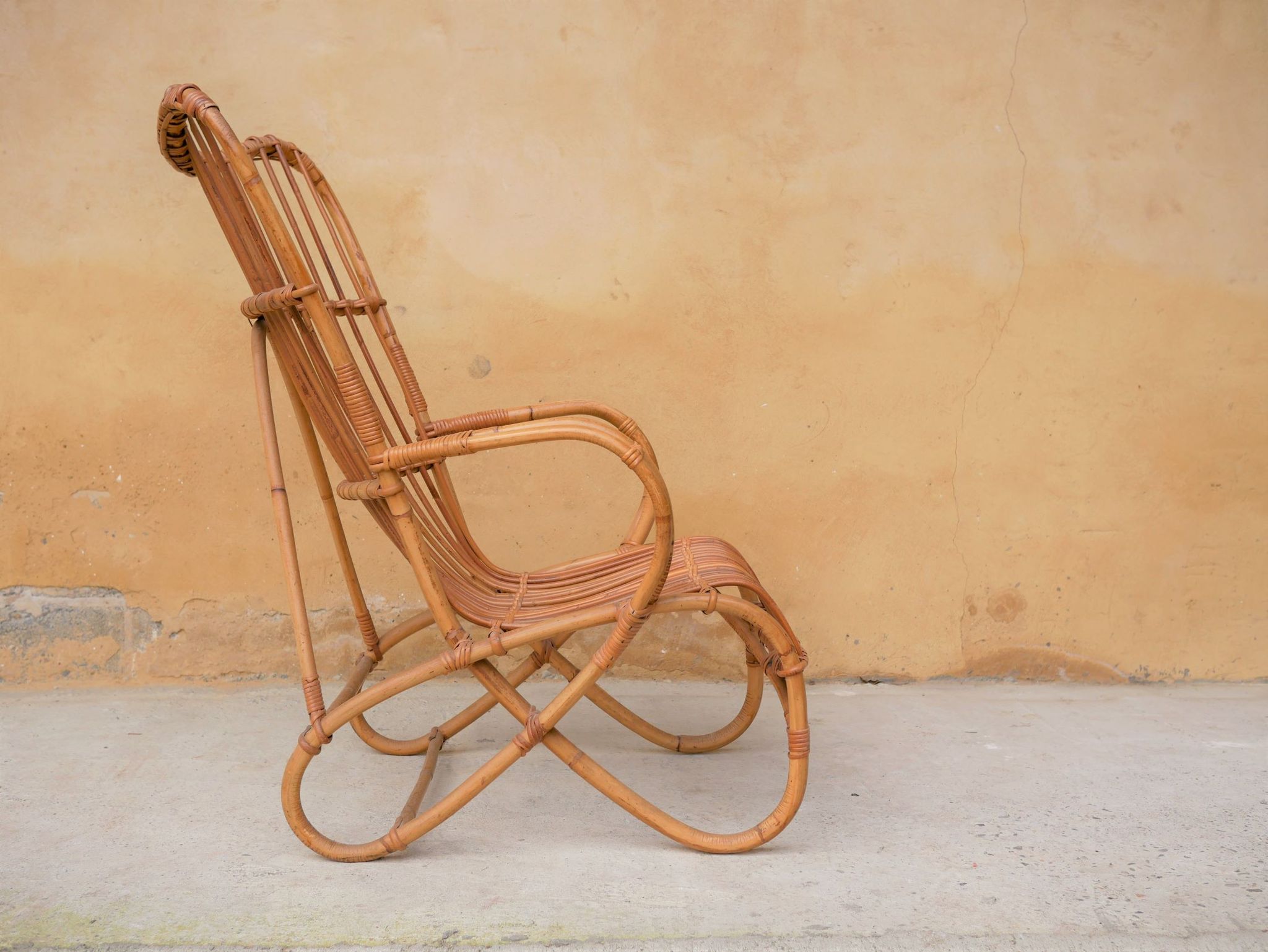 Vintage rattan chair by Louis Sognot