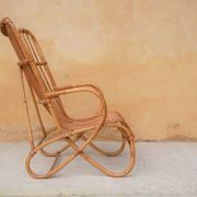 Vintage rattan chair by Louis Sognot