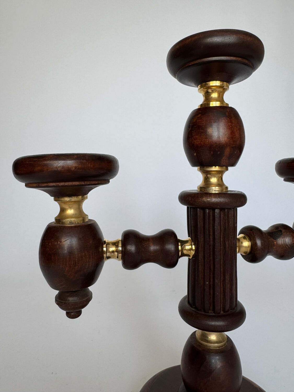 Vintage brutalist wooden candelabrum with gold hardware.