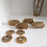 Gold door knobs and rosettes