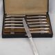 12 dessert, cheese, and hors d'oeuvre knives Grand Prix, Art Deco in silver-plated metal.