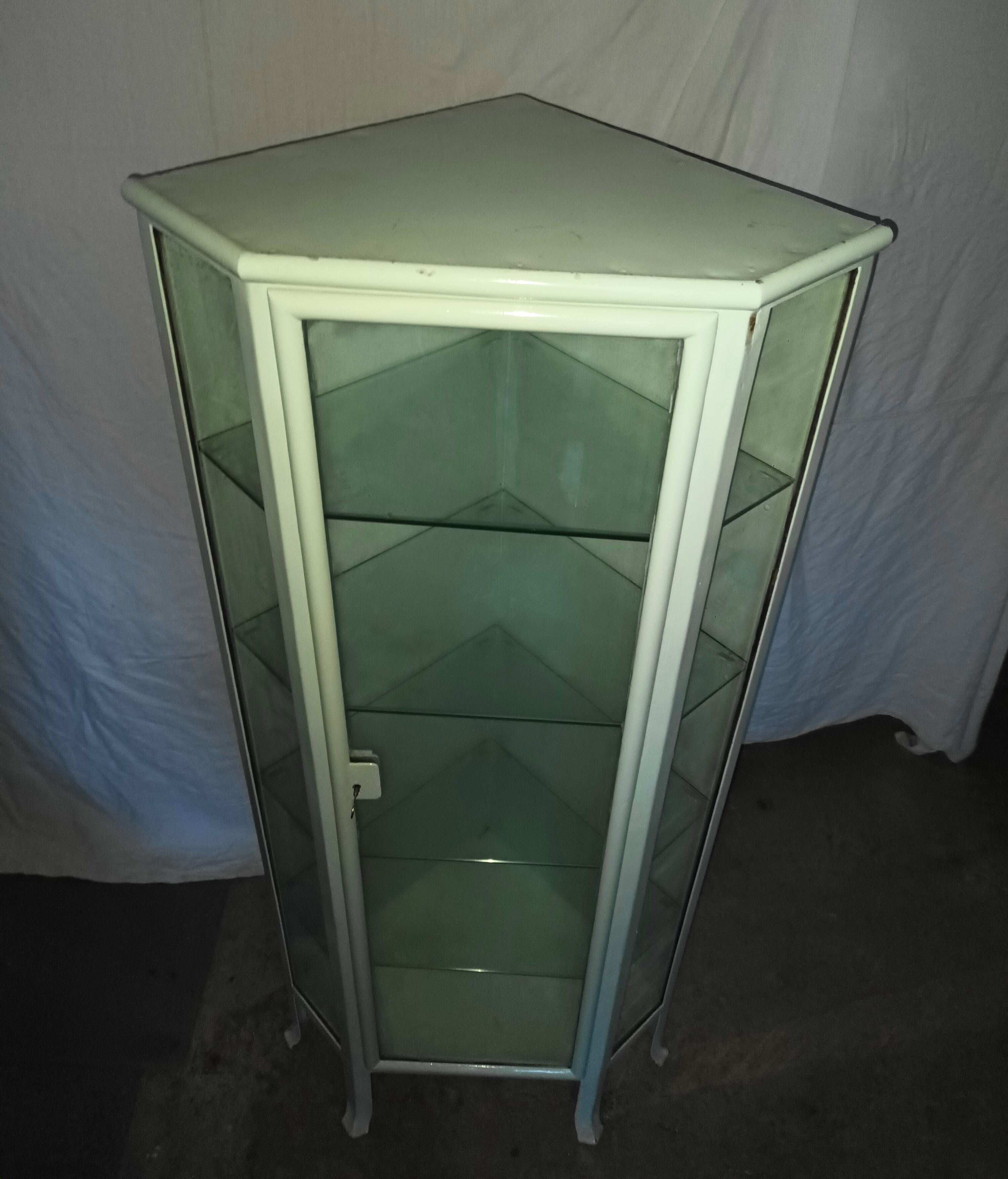 Painted metal ophthalmologist's corner display case, early 20th century