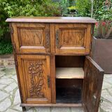 Low carved wooden sideboard