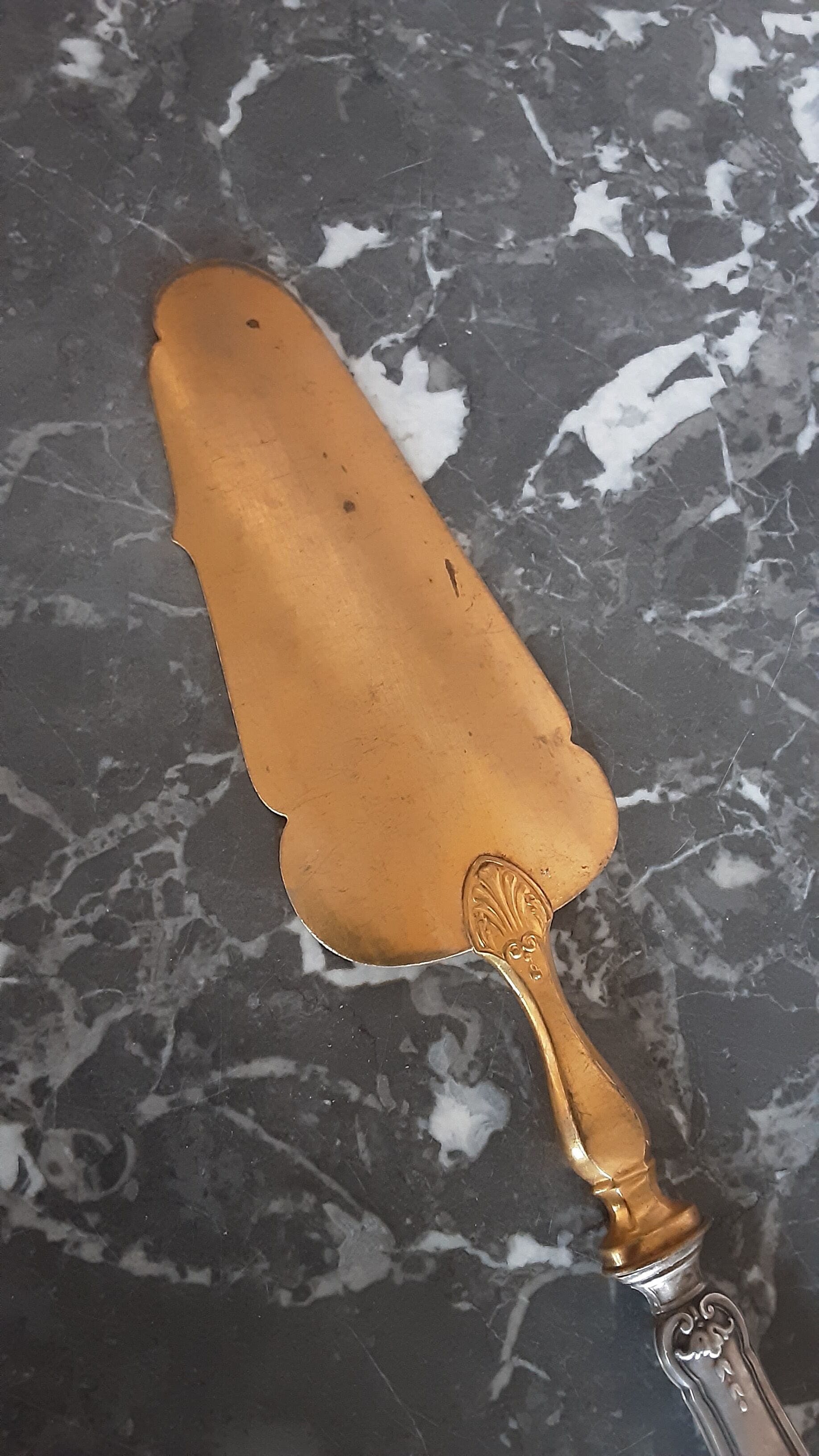 Old brass and silver pie shovel