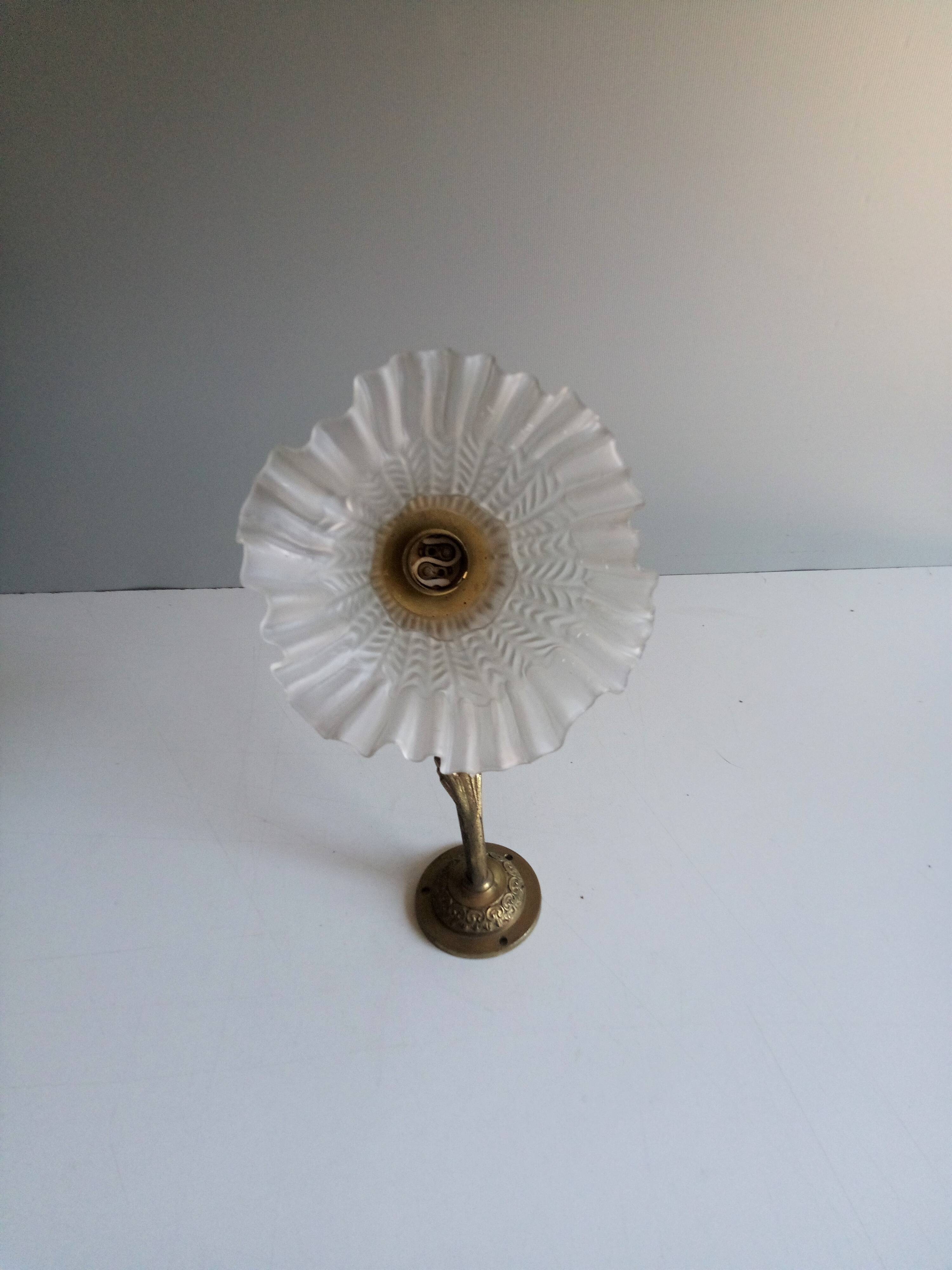 Bronze and pressed glass wall light. 1940