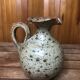 Old vintage brown stoneware pitcher