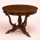 Table ronde Empire – acajou avec incrustations et pieds griffes