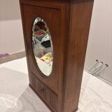 Wall cabinet with oval wall and drawer