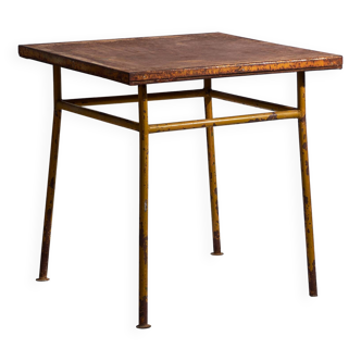 Antique ochre-colored outdoor table (c.1920)