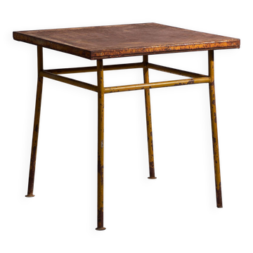 Old outdoor table in ochre colour (c.1920)