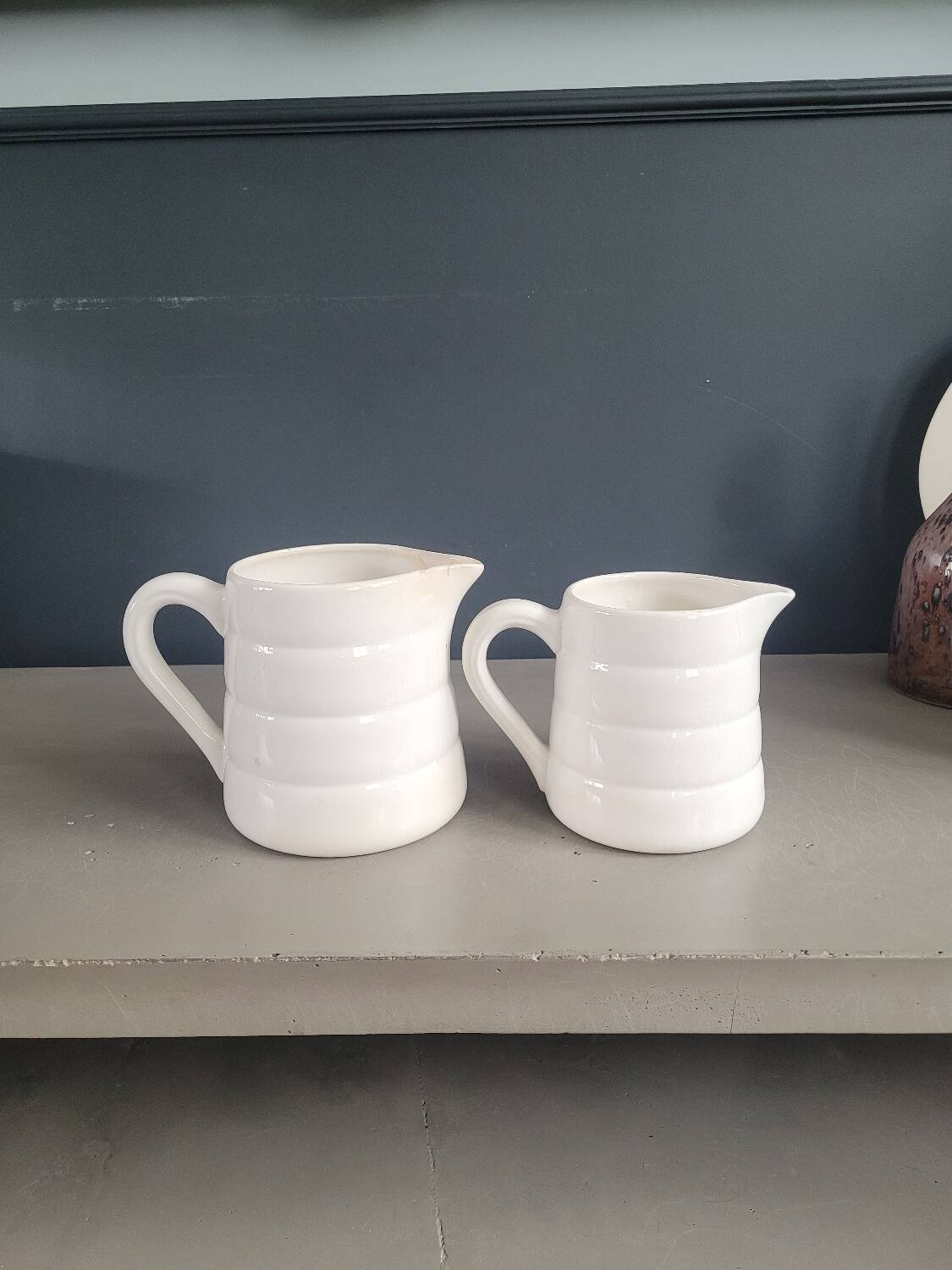 Pair of antique Gien porcelain pitchers