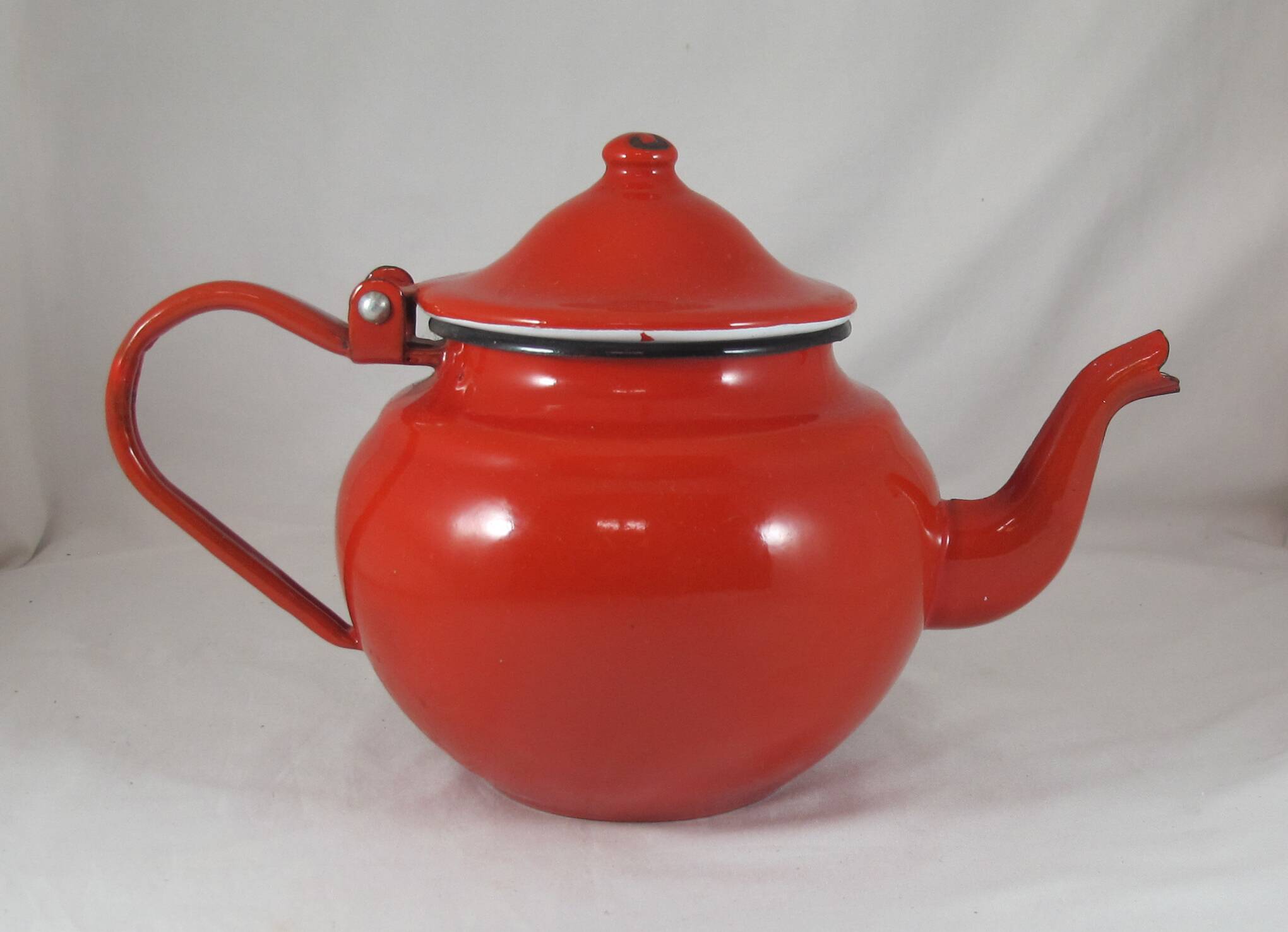 Vintage teapot coffee maker in red enameled metal