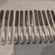 12 silver-plated Empire style table knives 25.3cm
