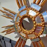 2 wooden sun mirrors and golden plaster