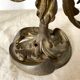 Pair of antique bronze candlesticks at the end of the table XIXth