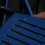 Set of two blue folding chairs