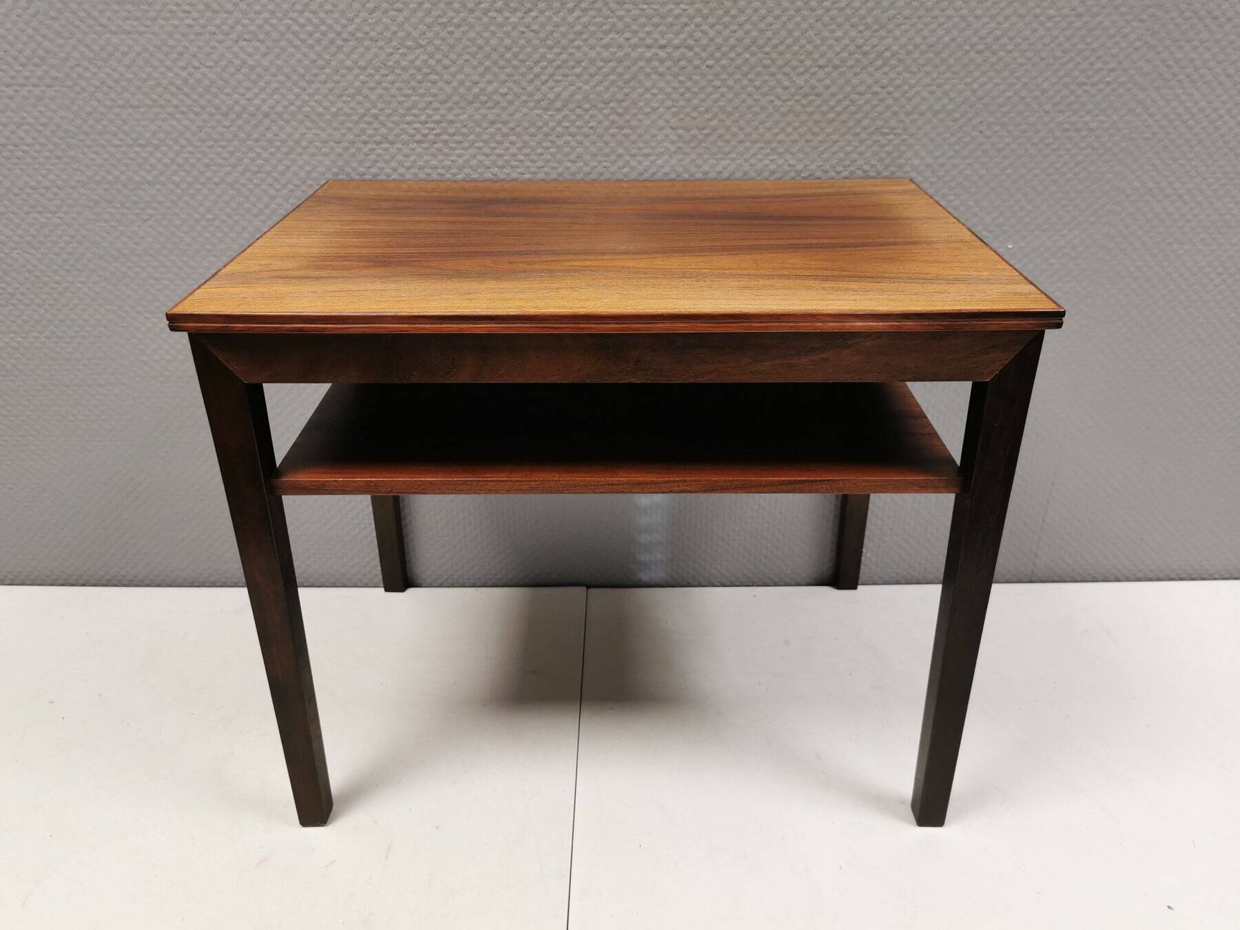 Nice side table in rosewood, probably Danish and from the 60s.