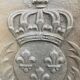 Old cast iron fireback with royal coat of arms