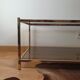 Table basse vintage dorée et verre fumé Rochebobois années 80