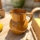 Antique glazed ceramic pitcher