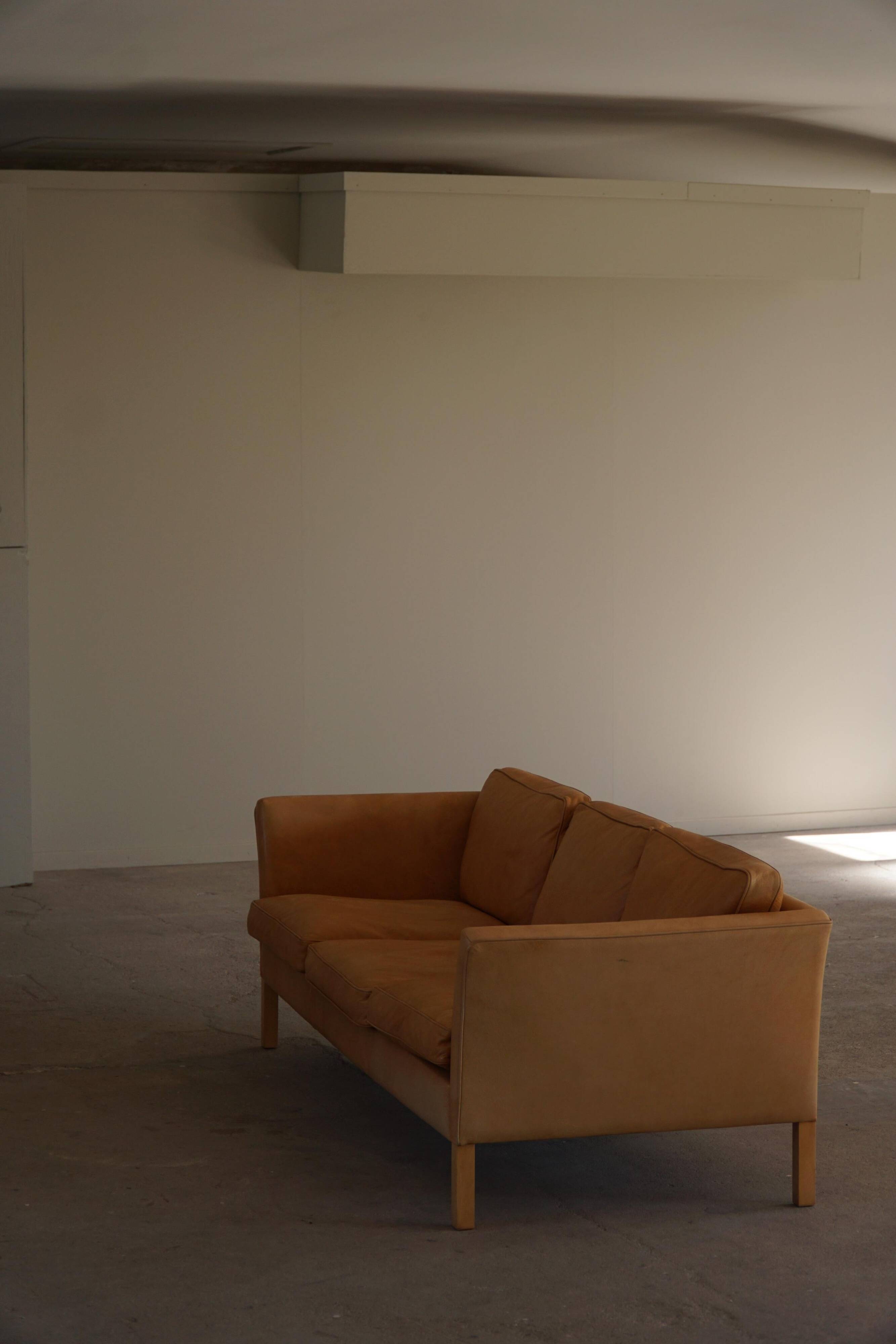 Danish Midcentury 3-seater canapé by Stouby in cognac brown leather, made in the 1970s.