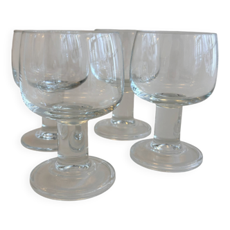 Set of 4 stemmed glasses. In good condition with some signs of wear.
