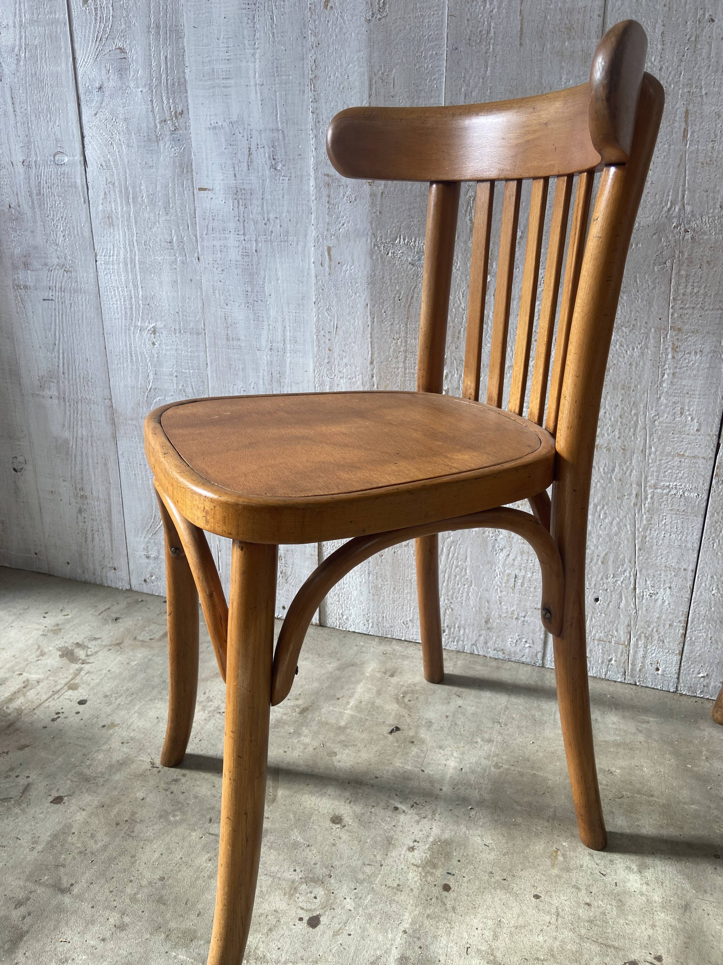 Mismatched curved wood bistro chairs (Fischel..)