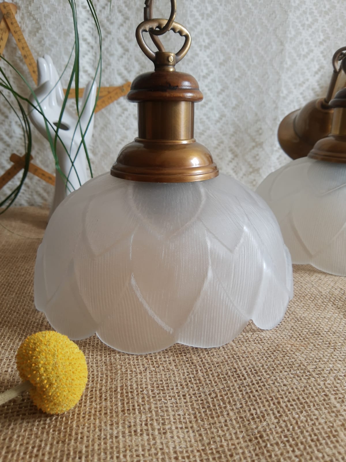 Pair of frosted glass flower pendant lights with vintage wood and brass